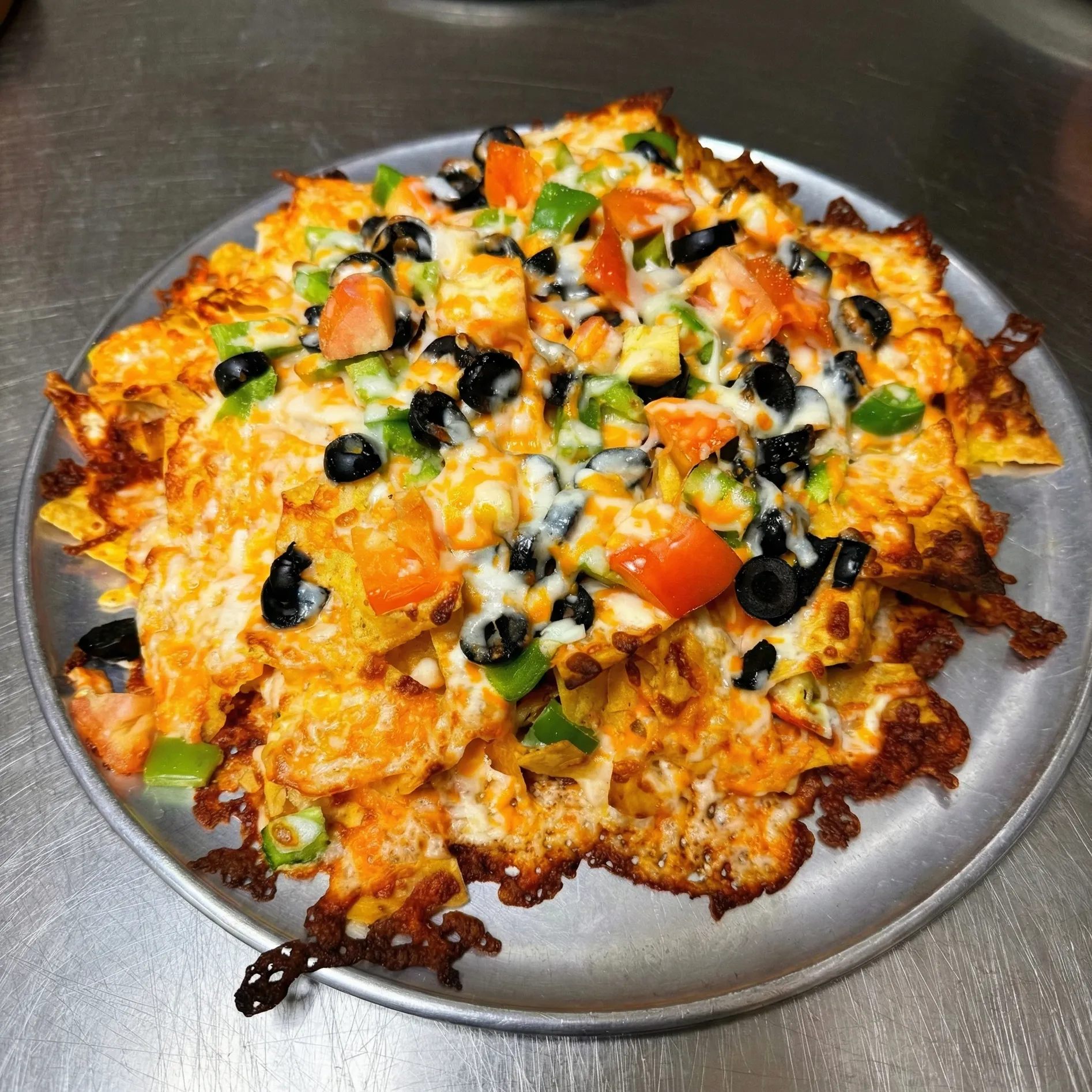 Fresh pizza at Pappa's Family Restaurant Edmonton - thick crust with generous toppings